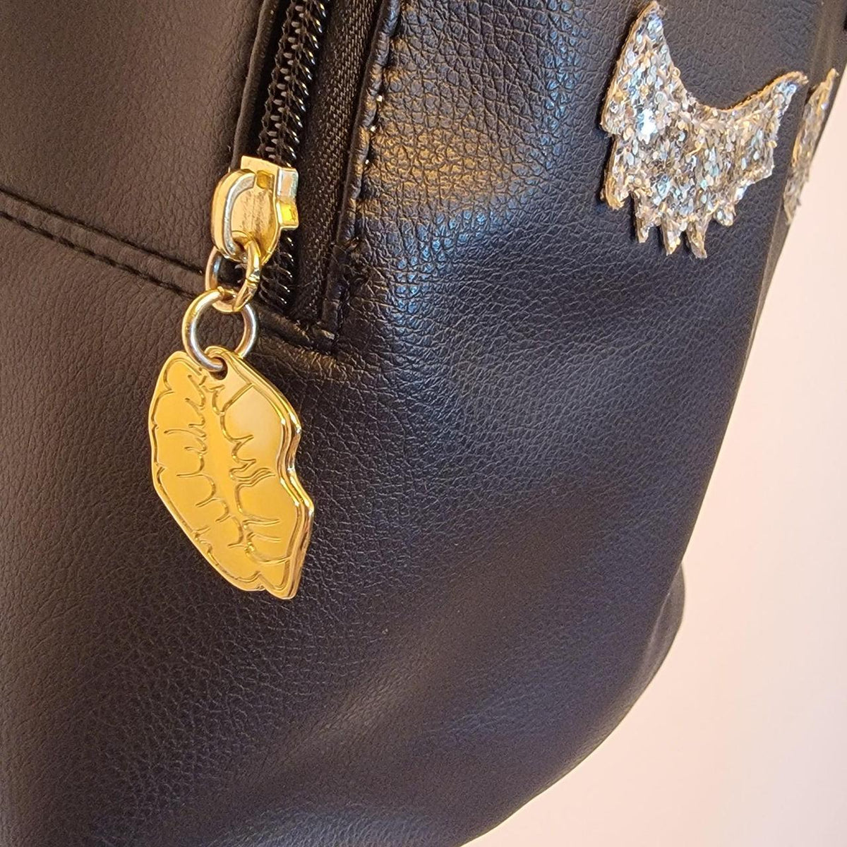 Black faux leather betsey johnson unicorn backpack with gold and silver